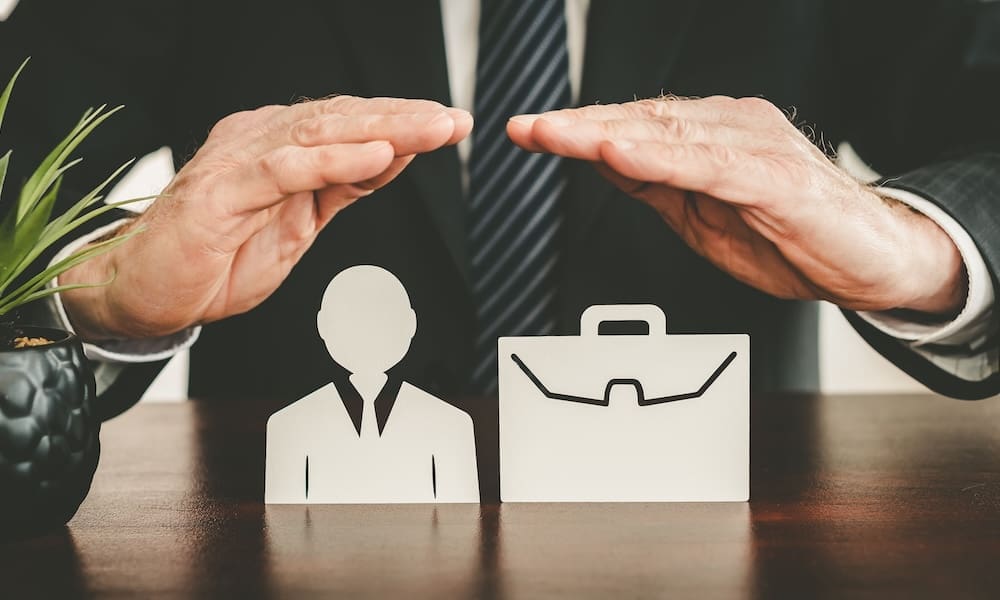 Insurer protecting an employee and a briefcase with his hands