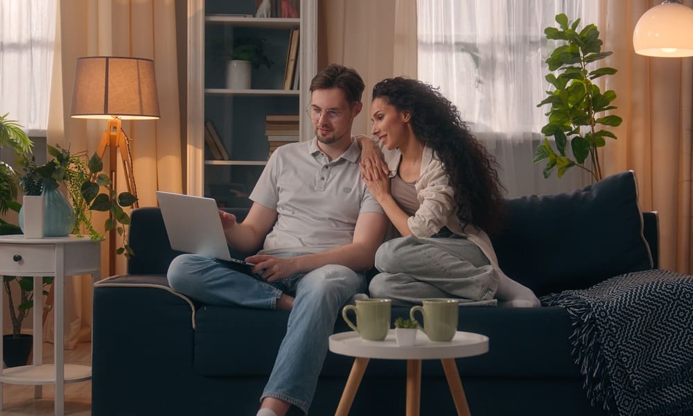 How Do I Find My Car Insurance Information - Couple Reviewing Insurance on Laptop
